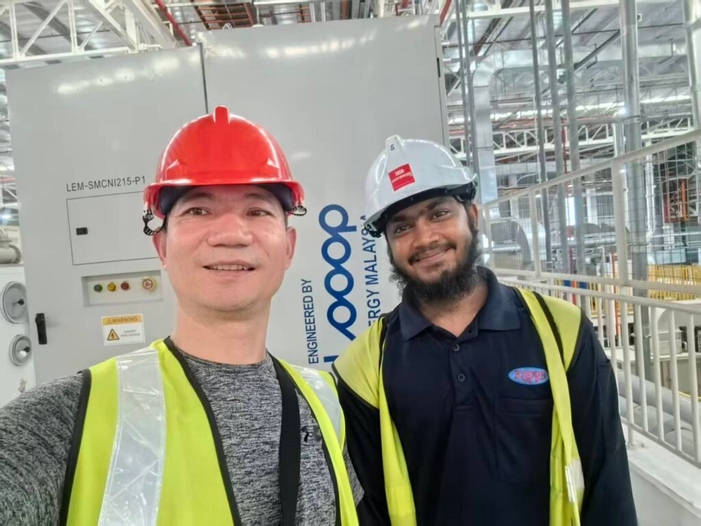 Technician commissioning 100kW 215kWh commercial solar storage solution for Malaysia industrial plant