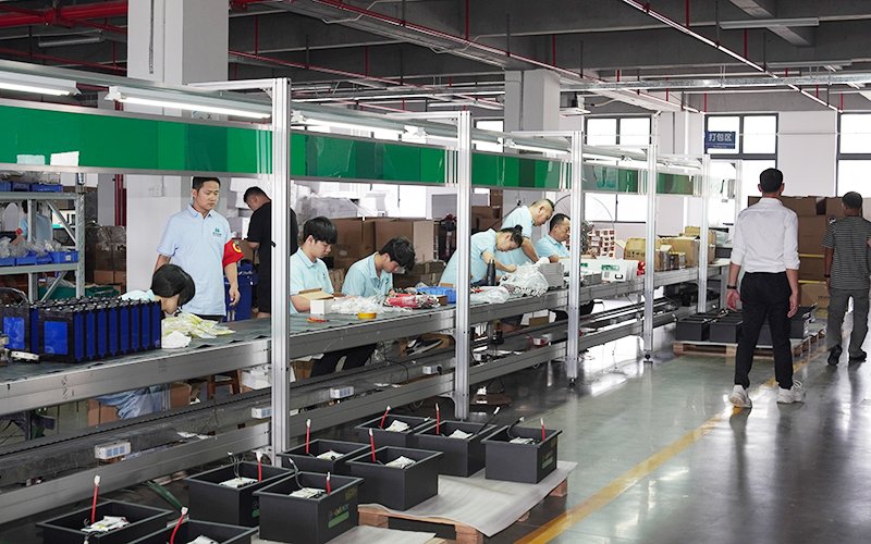 Cambodian partner discussing HMX ENERGY BESS system with technical team